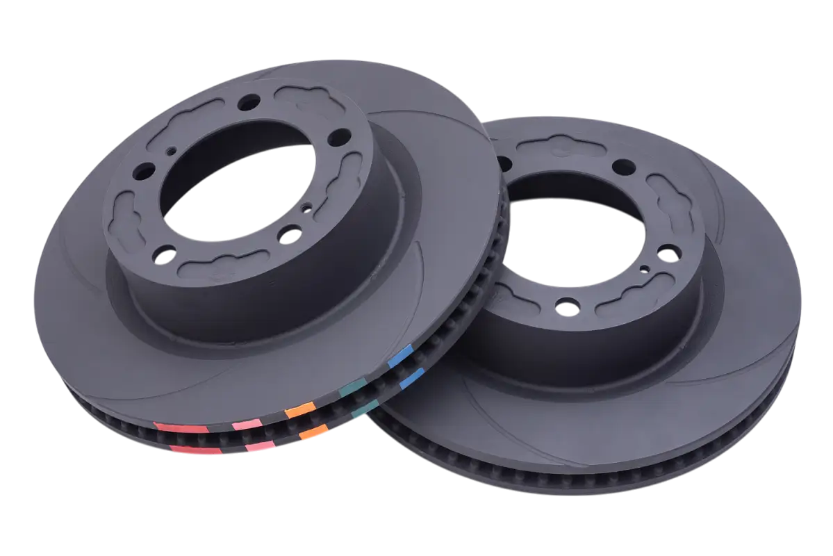 Pair of GX470 D-Line front rotors with vented design and color-coded edges, designed for improved heat dissipation and braking efficiency.