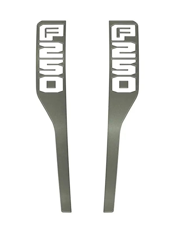 Two gray fender emblem overlays for Ford Super Duty 2023-2025 front fender emblems
