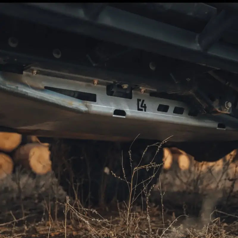 GX460 skid plate installed under vehicle, bolt-on steel design with CNC plasma cut details, providing durable protection in off-road terrain.