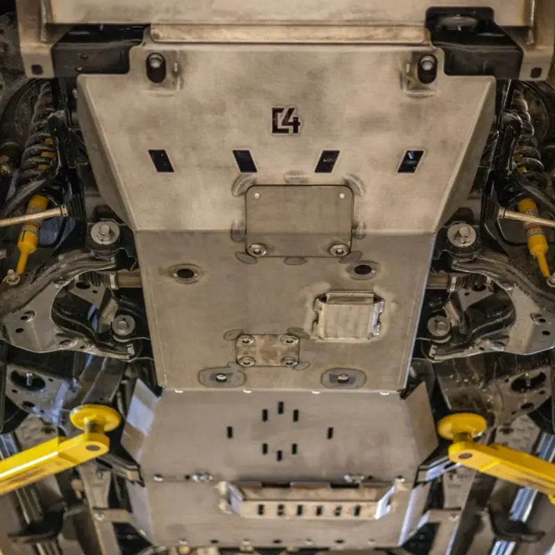 Tacoma skid plates installed under a vehicle, showcasing full undercarriage protection for 2nd and 3rd Gen models, 2005+.