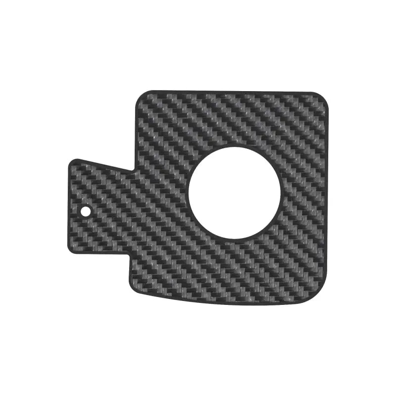 Carbon fiber-patterned gas cap holder insert for 2005-2023 Toyota Tacoma, standalone view.