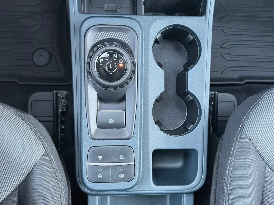 Gear selector accent overlay on 2022-2024 Ford Maverick center console with cupholders