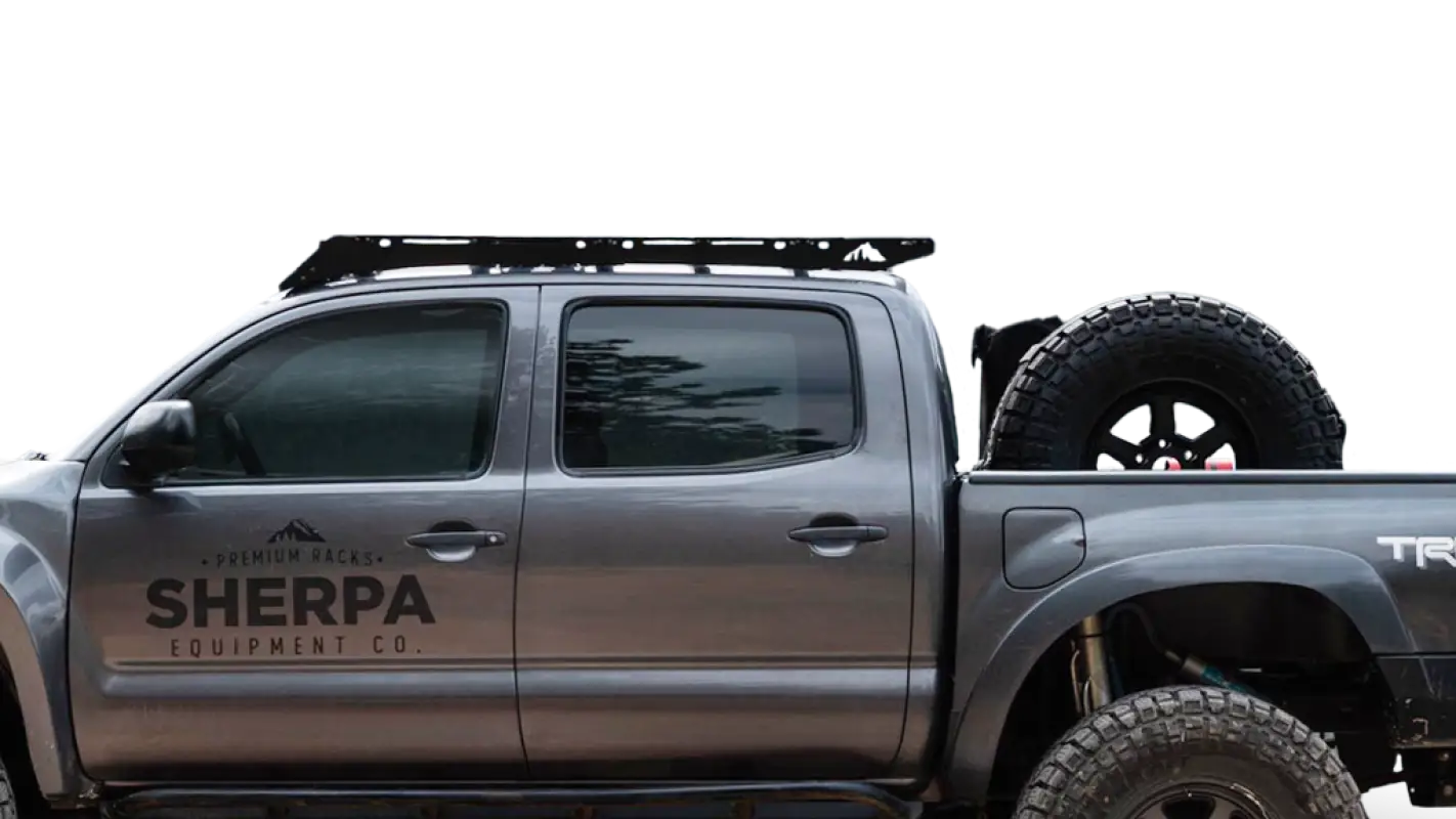 Gray pickup truck with roof rack and spare tire, Grand Teton Sport for Tacoma