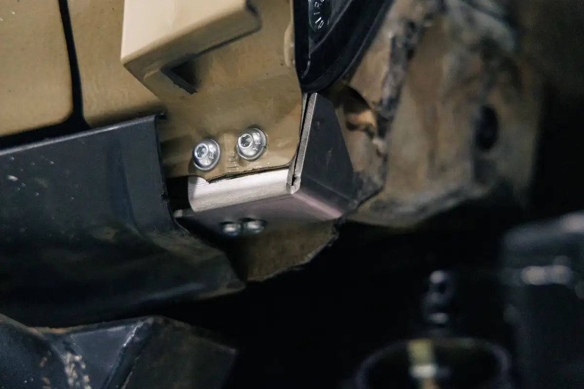 Detailed view of mounting hardware for high clearance fender liner on a 5th Gen 4Runner, showing secure bolt-in installation.