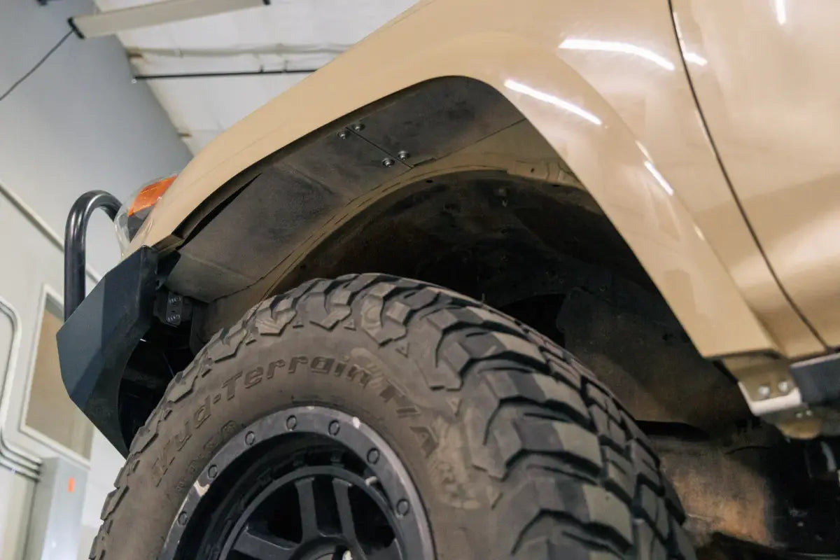 Underside view of high clearance fender liner on a 5th Gen 4Runner, emphasizing coverage and tire clearance.