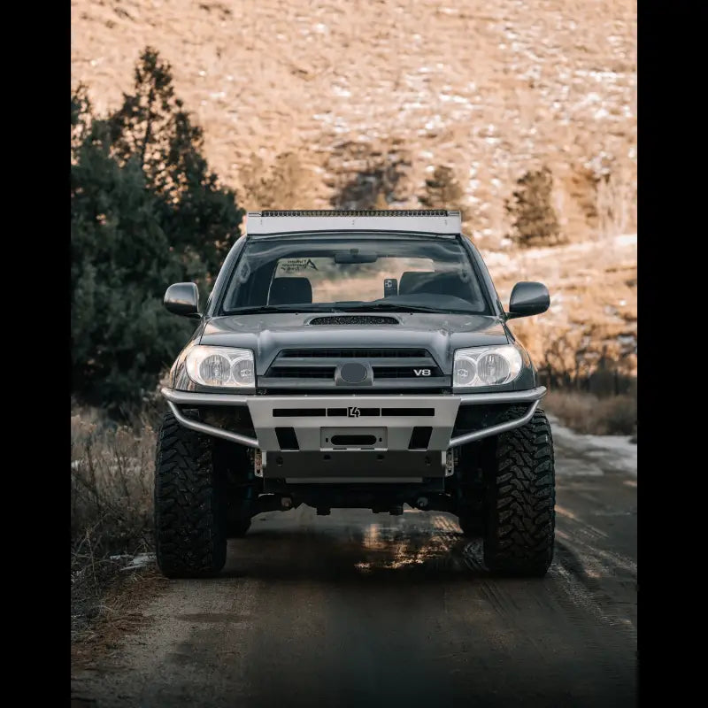 Front-facing shot of a 4Runner Hybrid Bumper on a 2003-2009 4Runner, designed for off-road performance with LED and winch features.