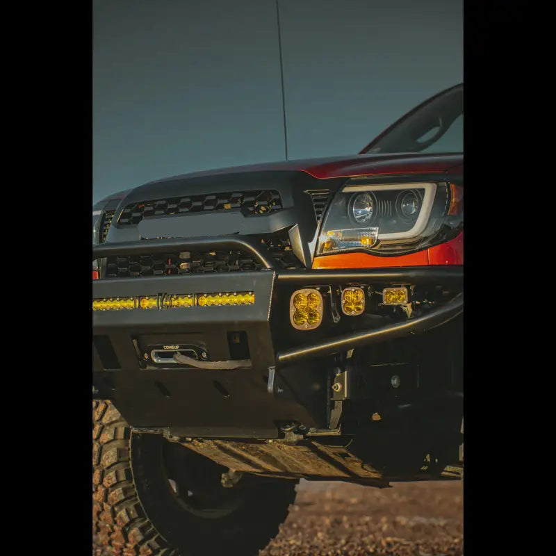 Close-up of 2nd Gen Tacoma hybrid front bumper with integrated light bar, winch compatibility, and durable steel construction.