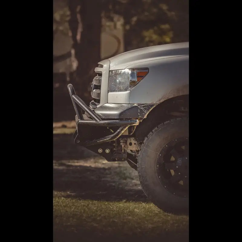 Side profile of a 2007-2013 Tundra with a Hybrid Front Bumper, showcasing its steel construction and enhanced clearance.