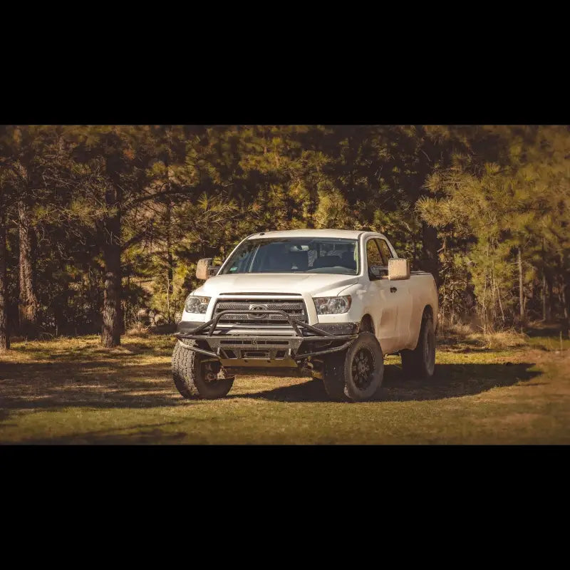 Wide shot of a 2007-2013 Tundra with a Hybrid Front Bumper, emphasizing its off-road performance and durable build.