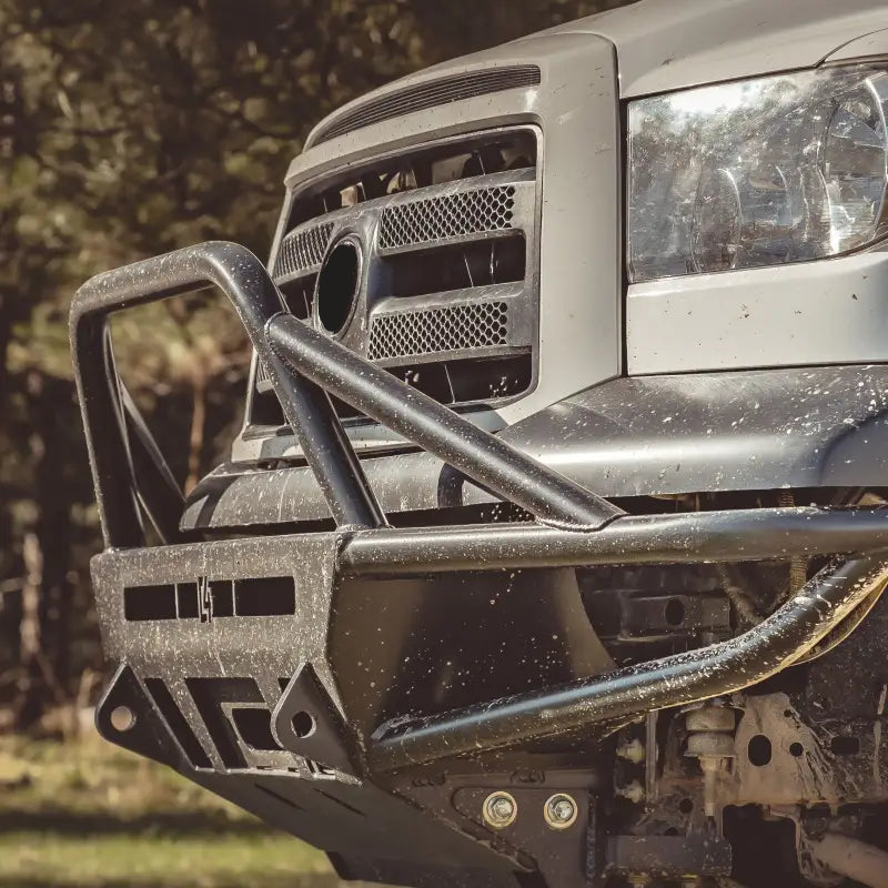Close-up of Tundra Hybrid Front Bumper for 2007-2013 models, featuring winch compatibility, steel construction, and rugged design.
