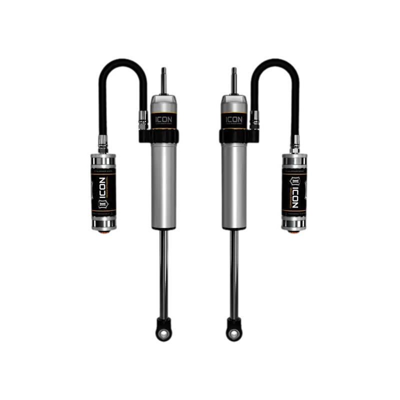 Silver and black ICON shock absorbers with remote reservoir for Tacoma aluminum series shocks