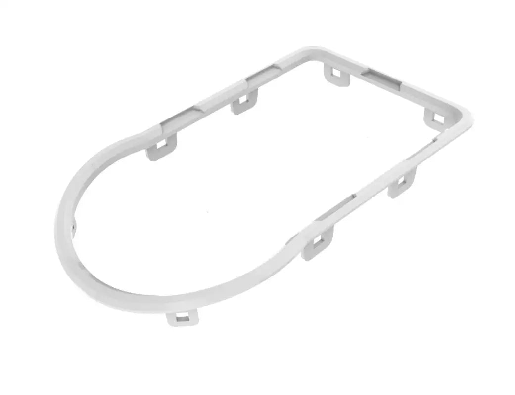 Tan oval trim piece from the chrome delete kit for Toyota Tacoma 2016-2023, designed for dashboard customization.