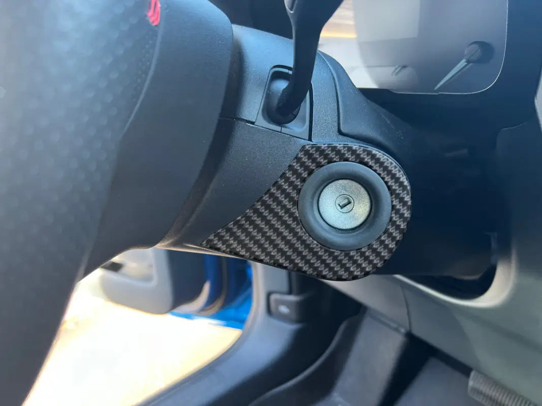 Car ignition switch with carbon fiber trim showcasing key ring accent overlay for Ford Maverick