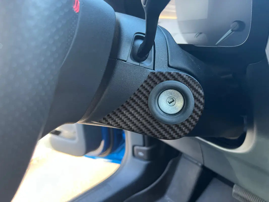 Car’s ignition switch with carbon fiber trim; key ring accent overlay for Ford Maverick