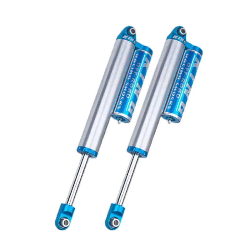 King 2.5 OEM Series rear shocks with piggyback reservoir for Chevy/GMC 2500/3500, featuring durable aluminum finish and blue accents.