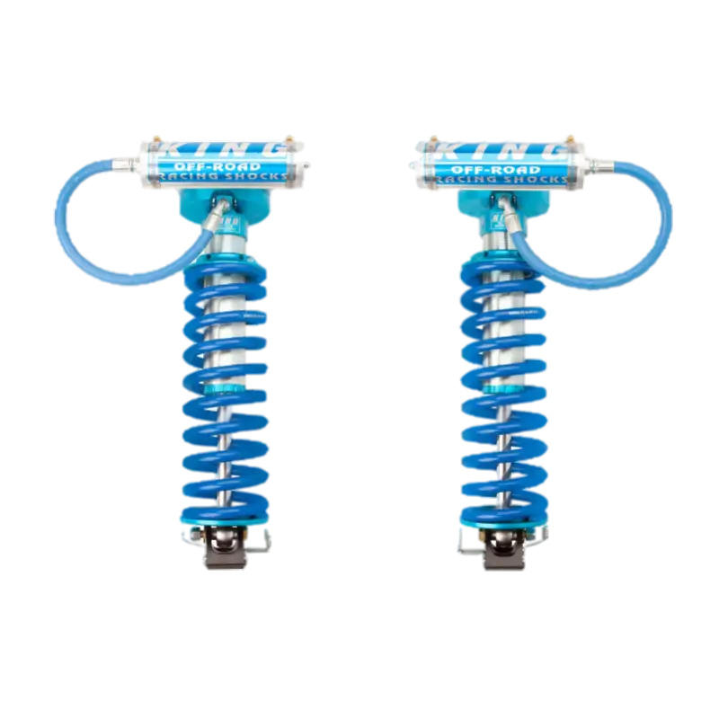 Ford F250/350 King 2.5 front coilover conversion with bolt-on design, featuring blue springs and external reservoirs for enhanced suspension performance.