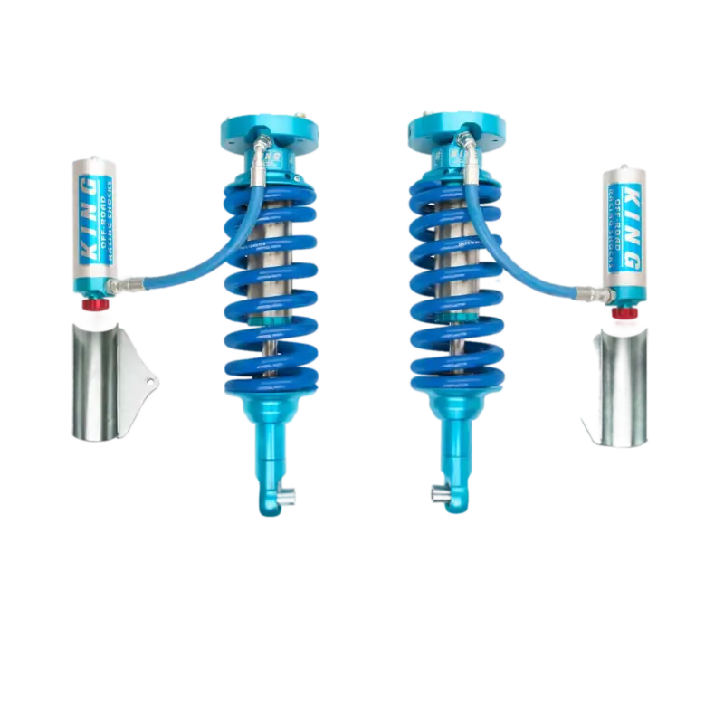 16-23 Nissan Titan XD coilover kit with 2.5 RR shocks, featuring blue springs and external reservoirs. 100% bolt-on design for enhanced suspension performance.