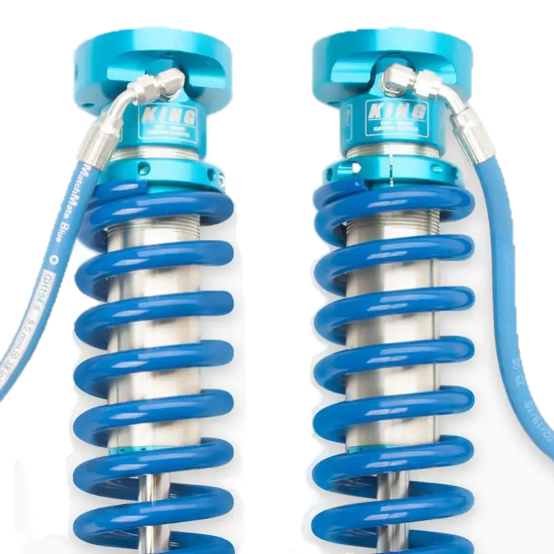 Close-up of 19-23 Ford Ranger coilover kit featuring blue anodized springs and adjustable ride height for enhanced suspension performance.