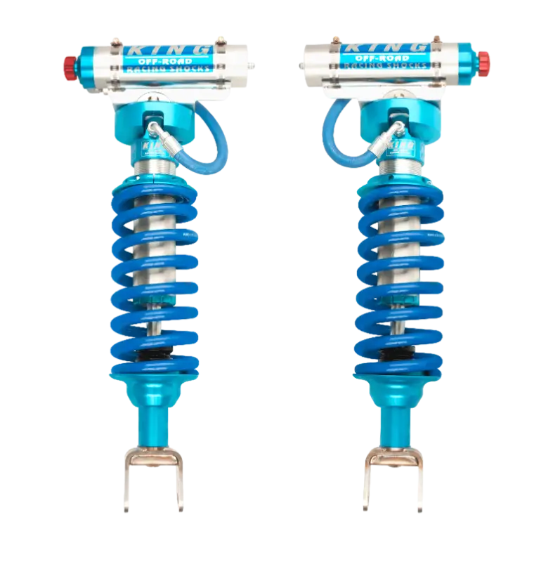 Ram 1500 Coilover Kit with 2.5-inch adjustable shocks, featuring blue springs and remote reservoirs for enhanced off-road performance.
