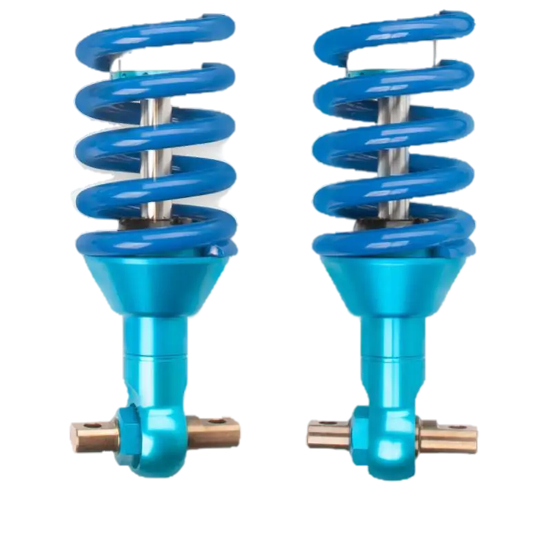 Close-up of King Off Road blue coil springs and anodized shock absorbers for Ford Ranger, designed for improved ride quality and durability.