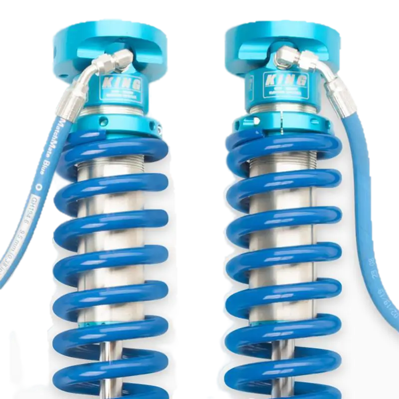 Detailed view of King Off Road adjustable coilovers with external reservoirs, showcasing premium build for 2019-2023 Ford Ranger suspension.