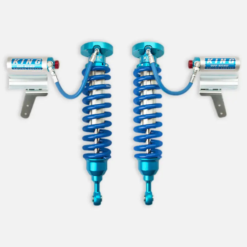 King 2.5 RR coilovers with blue springs and reservoirs for 2008-2021 Toyota Land Cruiser. Features adjustable height and factory-tuned performance.