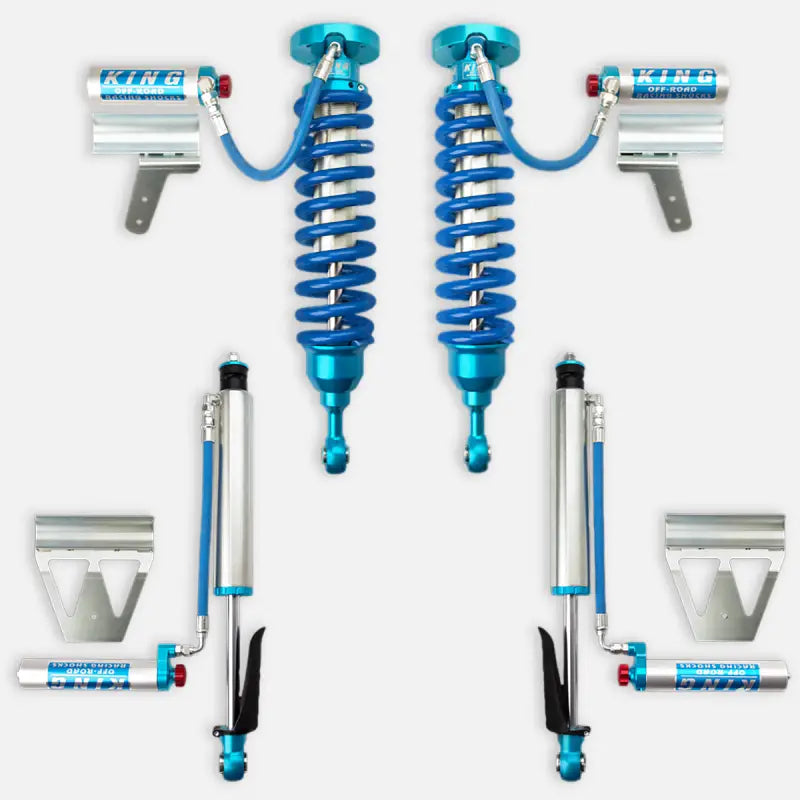 King 2.5 RR coilovers and rear shocks with adjusters for 2008-2021 Toyota Land Cruiser. Includes blue coil springs, reservoirs, and mounting brackets.