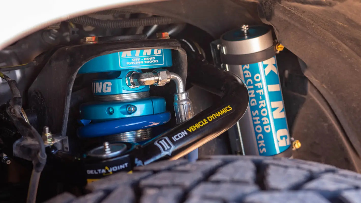 Installed King 2.5 RR EXT Travel Coilovers on a Toyota 4Runner, showcasing the blue anodized shocks and ICON Vehicle Dynamics components.