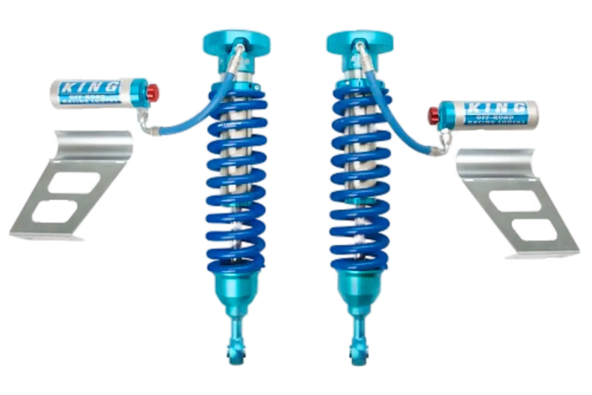 Toyota Tundra King 2.5 RR Series Coilovers with adjusters, featuring blue anodized finish, external reservoirs, and mounting brackets.