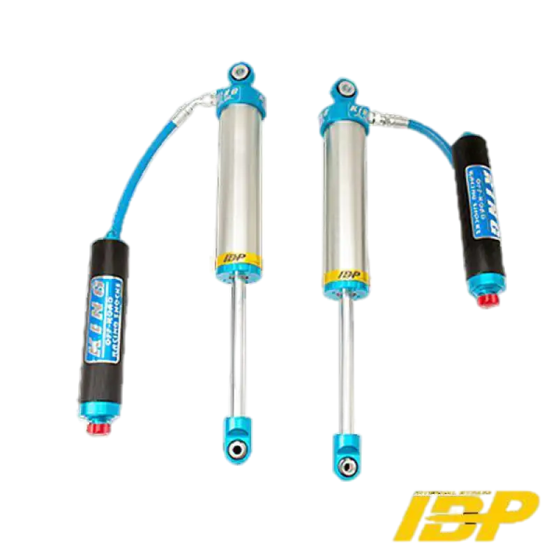 King 3.0 IBP rear shocks for 2019-2023 Chevy/GMC 1500, CAD plated with adjustable compression and PTFE rod ends, bolt-in design.