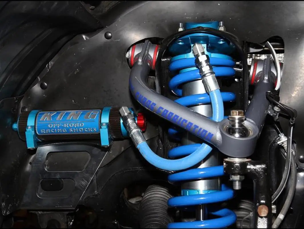 Installed King 3.0 front coilover with Total Chaos Fabrication upper control arm on Toyota Tundra, showcasing off-road suspension upgrade.