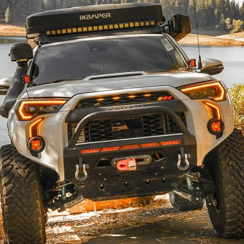 Toyota 4Runner equipped with LED DRL Fang Light Bezel Kit in amber mode, enhancing off-road style and visibility with rugged accessories.