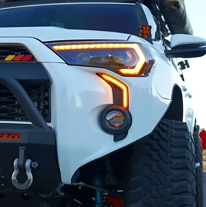 Side view of Toyota 4Runner with LED DRL Fang Light Bezel Kit in amber, showcasing a bold and modern lighting upgrade for 2014-2024 models.