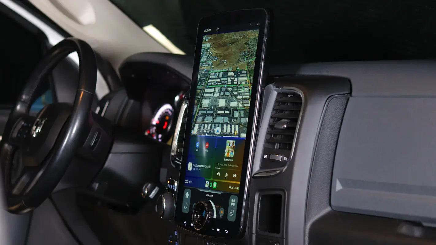 Linkswell XL T-Style Radio installed in a 2014-2018 Dodge Ram, featuring a 15.6-inch vertical touchscreen with Apple CarPlay and Android Auto.