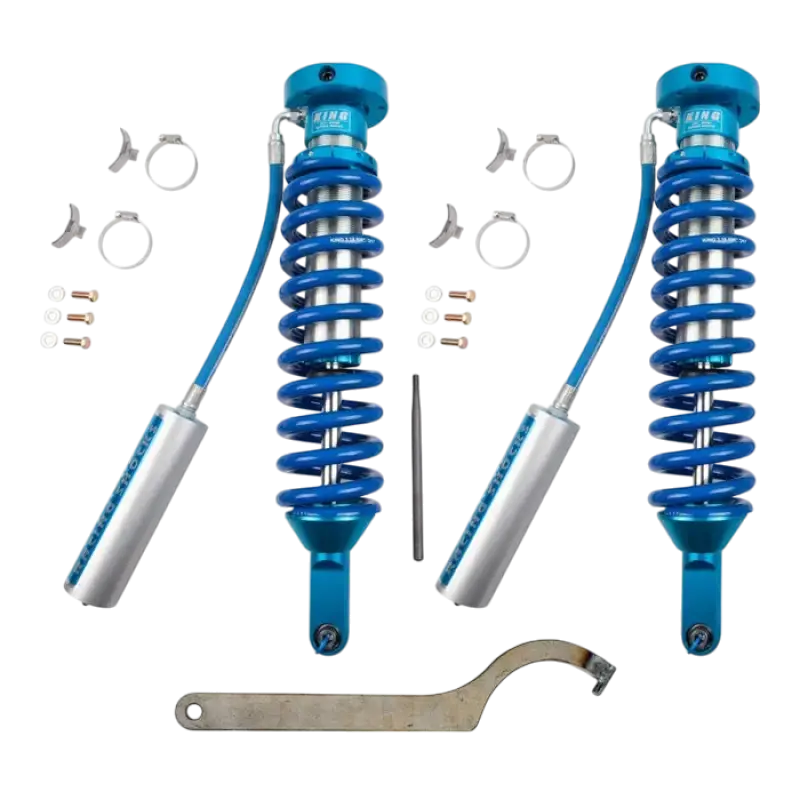 Long travel King shocks for 2005-2023 Tacoma, designed for Total Chaos Kit. Includes blue coilovers, reservoirs, and installation tools.