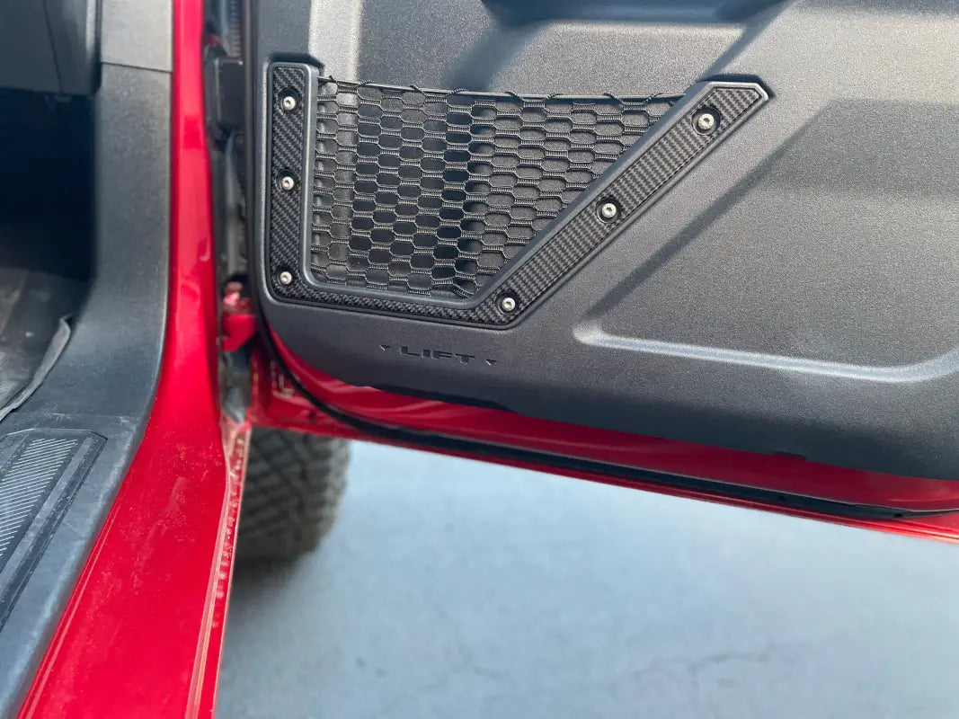 Red vehicle door with mesh pocket showing lower door accent overlays for Ford Bronco