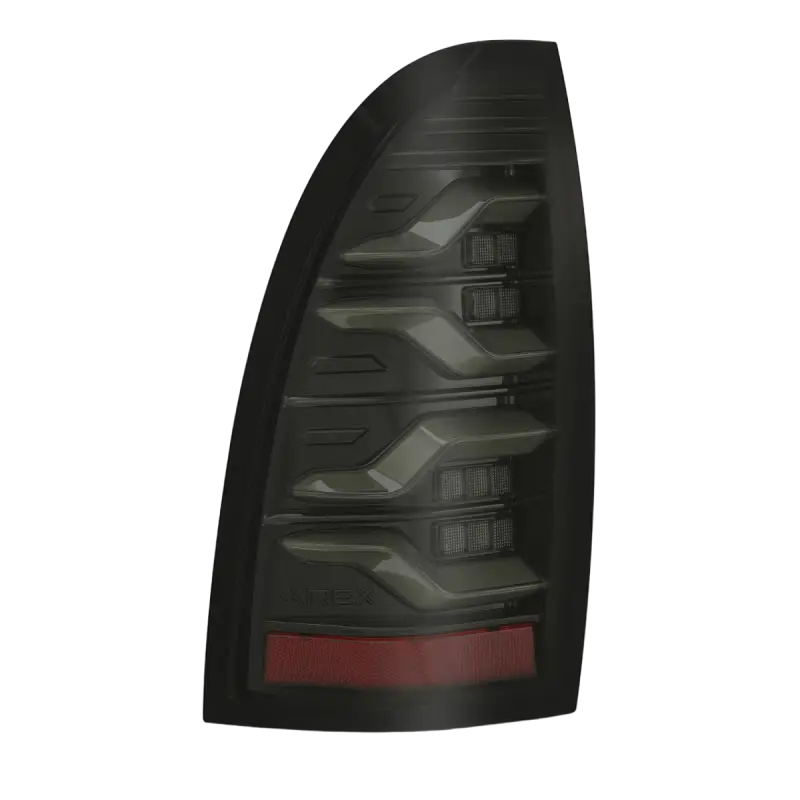 Single LUXX-Series LED tail light for Toyota Tacoma in smoked black with modern styling and enhanced visibility.