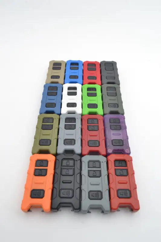 Array of Minimalist Key Fob V2 in 16 color options, designed for Toyota Tacoma, Tundra, and 4Runner, with a spare key slot and bottle opener.