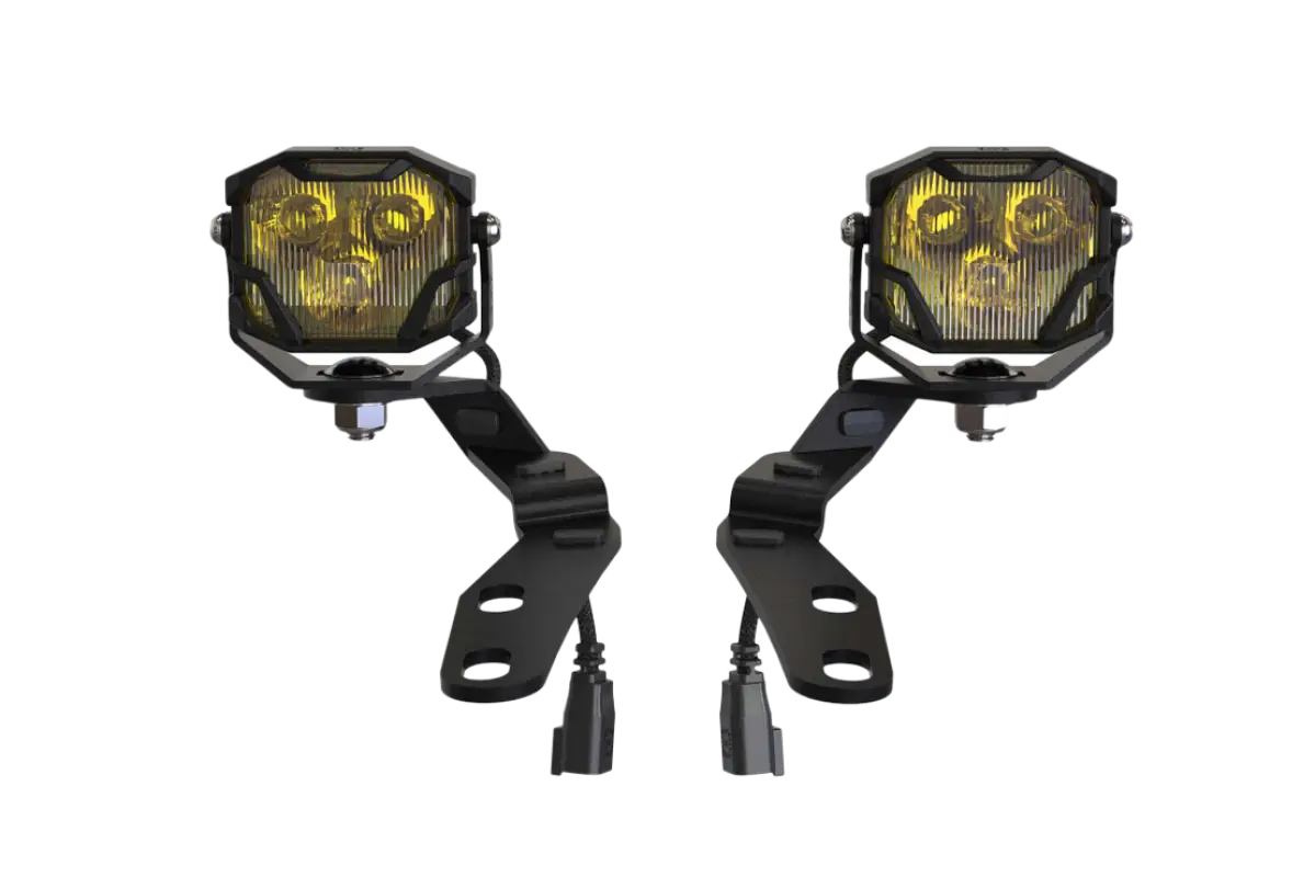 Front view of Morimoto HXB 4Banger Ditch Light Kit with yellow lenses and mounting brackets for Tacoma 2016-2023.
