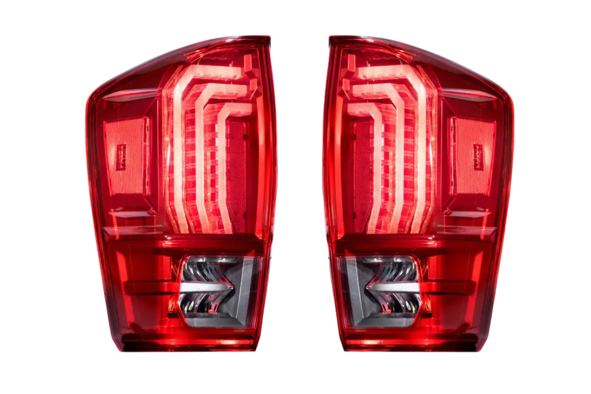 Morimoto Tail Lights for Tacoma (2016-2023) with red lens, showcasing sleek LED design and OEM fitment for enhanced vehicle lighting.
