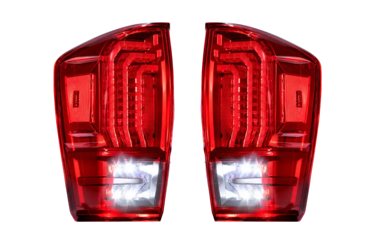 Morimoto Tail Lights for Tacoma (2016-2023) illuminated with red lens and bright LED accents, designed for modern styling and superior visibility.
