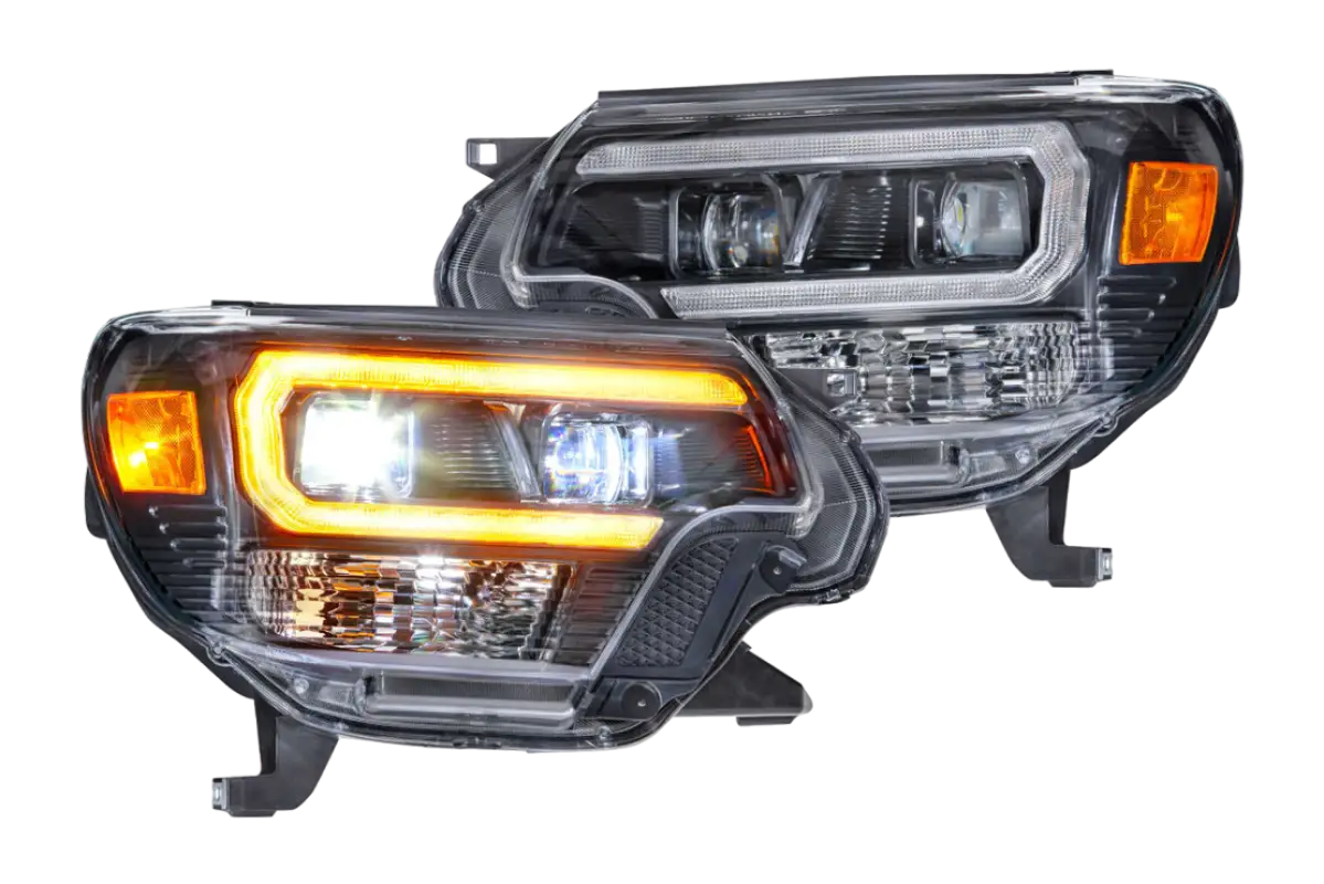 Morimoto XB Hybrid LED Amber DRL headlights set for Tacoma 2012-2015, featuring modern design with amber daytime running lights.