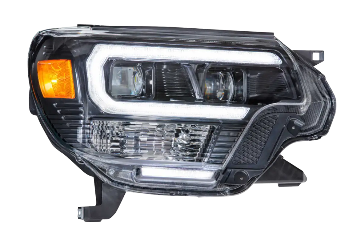 Single Morimoto XB LED Hybrid Headlight for Tacoma (2012-2015) with sleek LED accents and amber turn signal.