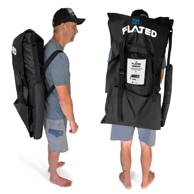 Man wearing the Flated carrying bag for the MR Full-Size 5.5' Bed air-topper shell, showcasing its portability and lightweight design.