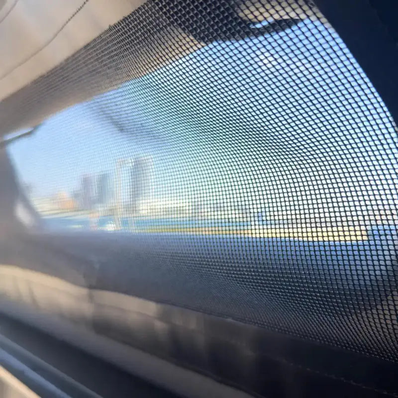 View through the mesh window of the MR Full-Size 5.5' Bed air-topper shell, showing its breathable and ventilated design.