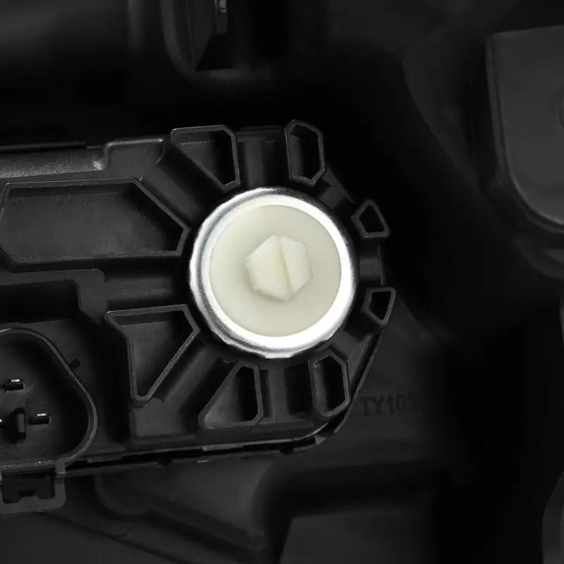 Close-up of adjustment knob on AlphaRex NOVA-Series LED projector headlight, designed for precise alignment on Toyota Tundra and Sequoia.