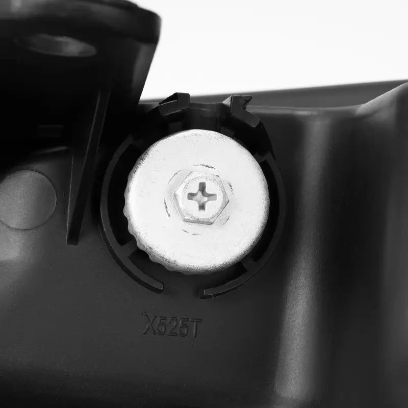 Close-up of mounting screw on AlphaRex NOVA-Series LED projector headlight, showcasing robust construction for 22-24 Toyota models.