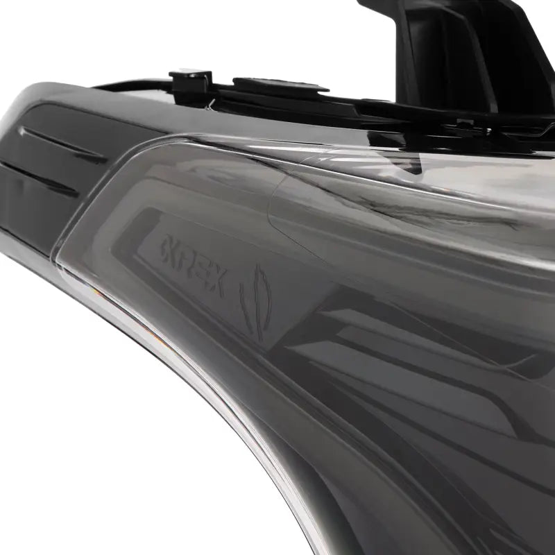 Side profile of AlphaRex NOVA-Series LED projector headlight in Alpha-Black, showcasing the sleek and aerodynamic design.