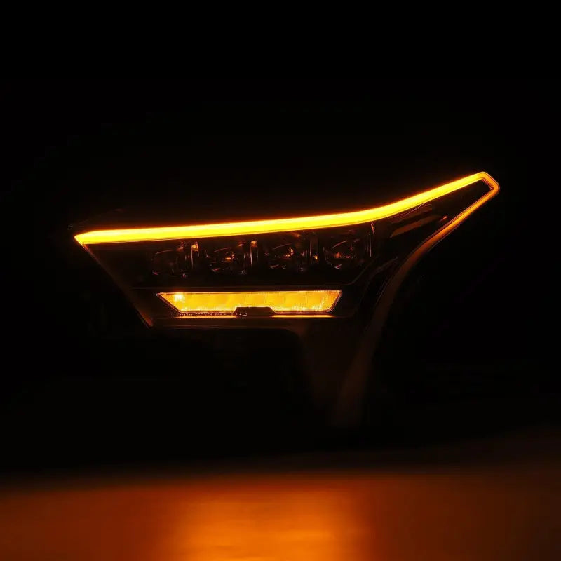 AlphaRex NOVA-Series LED projector headlight in amber mode, highlighting the sequential turn signal functionality and modern design.