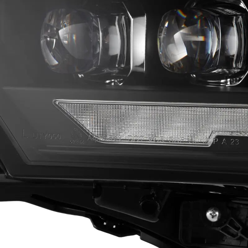 Close-up of the lens and LED components of AlphaRex NOVA-Series projector headlights, highlighting premium build quality and attention to detail.